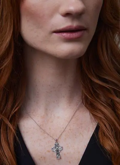 Close up shot of red haired model wearing Sterling Silver Emerald Celtic Cross Pendant